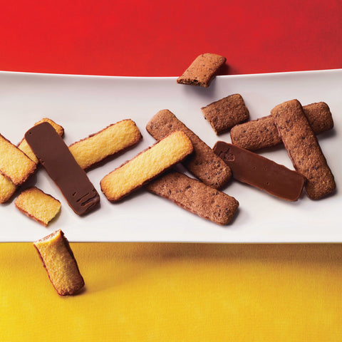 ROYCE' Chocolate - Image shows baton-shaped cookies on a white plate with red and yellow background.