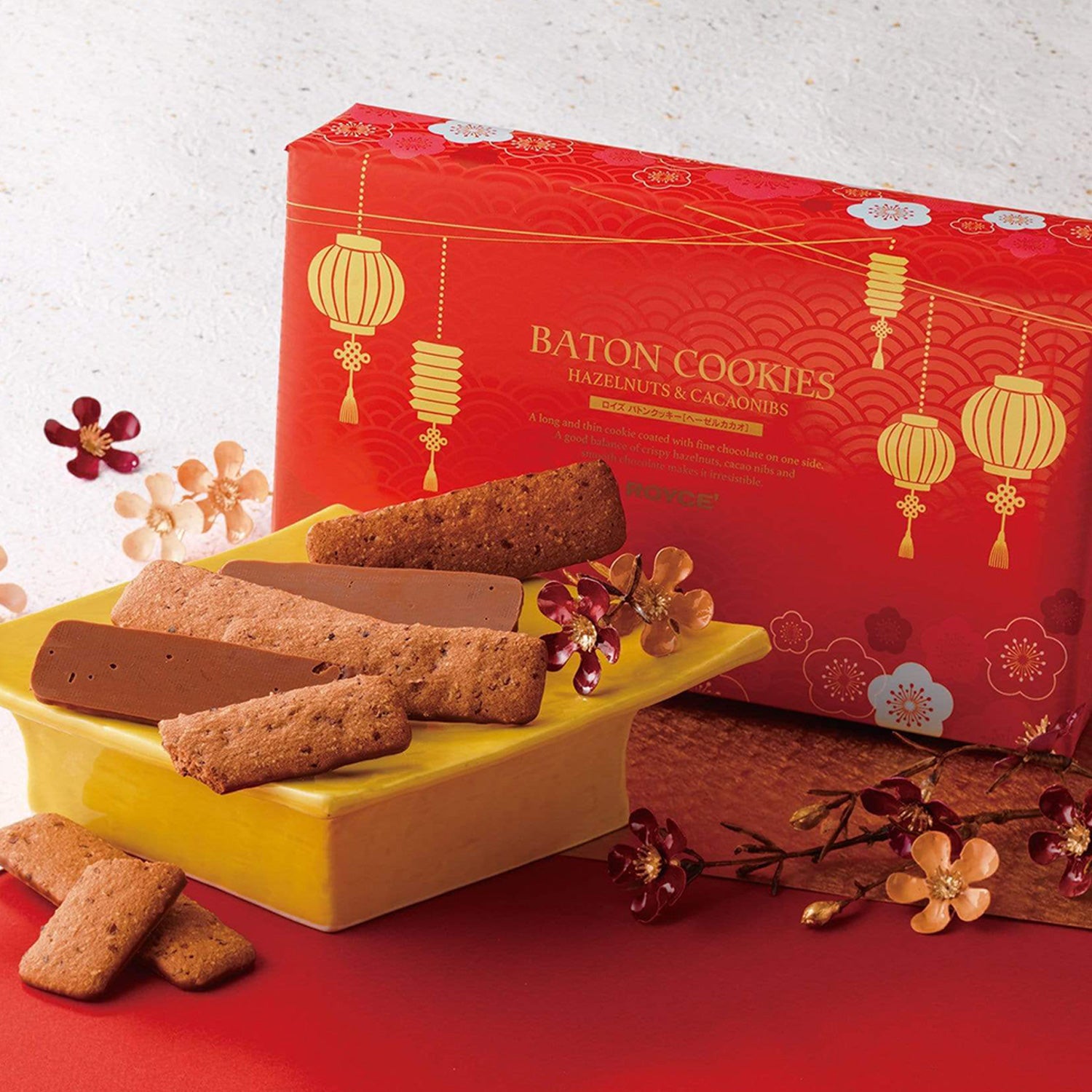 Image shows cookies on a plate with a red printed box.