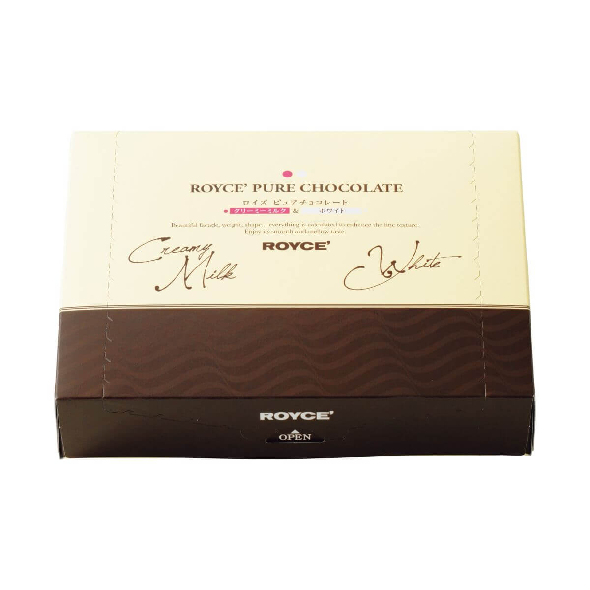 ROYCE' Chocolate - Pure Chocolate "Creamy Milk & White" - Image shows a box in white and brown. Text on top: ROYCE' Pure Chocolate Beautiful facade, weight, shape... everything is calculated to enhance the fine texture. Enjoy its smooth and mellow taste. Creamy Milk. ROYCE'. White. Text below: ROYCE'. Open.